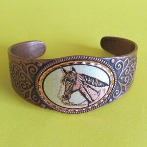 Copper cuff bracelet with horse head design